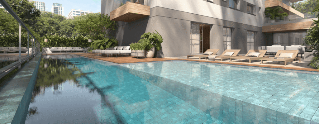 Imagem da piscina com raia e prainha solarium do Unik Green Residence